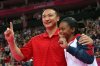 Gabrielle-Douglas-of-the-United-States-and-her-coach-Liang-Chow-hold-up-a-finger.jpg